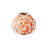 Decorative vase with orange floral patterns on a white background